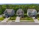 Beautiful aerial view showcasing three well-maintained homes and lush landscaping in a desirable neighborhood at 1632 Ferntree Ct, Morrisville, NC 27560