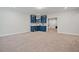 Spacious basement area with modern blue bar and ample room at 1632 Ferntree Ct, Morrisville, NC 27560