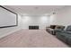 Spacious basement home theater with a large screen and comfortable seating area at 1632 Ferntree Ct, Morrisville, NC 27560