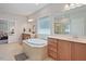 Bathroom features a soaking tub, tile floor, and double sinks at 1632 Ferntree Ct, Morrisville, NC 27560
