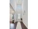 Bright foyer with soaring ceilings, wood floors, and ample natural light at 1632 Ferntree Ct, Morrisville, NC 27560