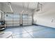 Spacious two car garage with epoxy flooring and automatic doors for convenient parking and storage at 1632 Ferntree Ct, Morrisville, NC 27560