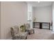 Neutral upstairs hallway area with seating, lighting and view to other rooms at 1632 Ferntree Ct, Morrisville, NC 27560