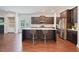 Modern kitchen featuring a center island, stainless appliances, and dark cabinets at 1632 Ferntree Ct, Morrisville, NC 27560