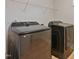 Laundry room featuring newer front-loading washer and dryer at 1632 Ferntree Ct, Morrisville, NC 27560