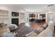 Open-concept living space showcasing a fireplace, living room, and modern kitchen at 1632 Ferntree Ct, Morrisville, NC 27560