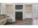 Elegant fireplace with built in cabinets and shelves at 1632 Ferntree Ct, Morrisville, NC 27560