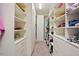 Walk-in closet with lots of built-in shelving at 1632 Ferntree Ct, Morrisville, NC 27560