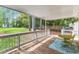 Enjoy the beautiful backyard from this covered back porch with lovely view and stylish decor at 1703 Cranston Road Rd, Garner, NC 27529