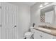 Bathroom featuring a modern vanity, a toilet, and a neutral color scheme at 1703 Cranston Road Rd, Garner, NC 27529