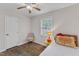 Comfortable bedroom showcases wood floors, a single bed, and a bright window at 1703 Cranston Road Rd, Garner, NC 27529