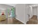 View of Foyer with Stylish flooring, opening to the entry and hallway with neutral paint at 1703 Cranston Road Rd, Garner, NC 27529