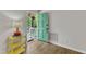 Inviting foyer with stylish flooring, colorful accents, and a cheerful green door leading outside at 1703 Cranston Road Rd, Garner, NC 27529