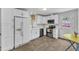 Bright kitchen with white cabinets, stainless steel appliances, and ample counter space at 1703 Cranston Road Rd, Garner, NC 27529