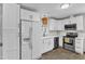 Modern kitchen with white cabinetry, updated stainless appliances, and a bright, clean aesthetic at 1703 Cranston Road Rd, Garner, NC 27529