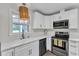 Kitchen with stainless steel appliances, granite countertops and a modern pendant light at 1703 Cranston Road Rd, Garner, NC 27529