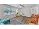 Comfortable living room with wood-look floors, bright windows, and neutral paint at 1703 Cranston Road Rd, Garner, NC 27529