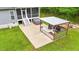 Backyard view featuring an outdoor kitchen, patio, and hot tub, ideal for entertaining at 179 Carrie Dr, Archer Lodge, NC 27527