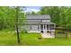 Backyard featuring a screened-in porch, patio area, and lush green lawn at 179 Carrie Dr, Archer Lodge, NC 27527