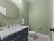 Elegant half bathroom featuring modern fixtures and stylish vanity at 179 Carrie Dr, Archer Lodge, NC 27527