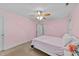 Pretty pink bedroom with a closet and great natural light at 179 Carrie Dr, Archer Lodge, NC 27527