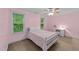 Bright pink bedroom with carpet, ceiling fan and lots of natural light at 179 Carrie Dr, Archer Lodge, NC 27527