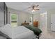 Serene bedroom featuring neutral tones, two windows, and natural light at 179 Carrie Dr, Archer Lodge, NC 27527