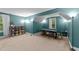 Bonus room featuring game table, natural light from the windows, and carpeted floors at 179 Carrie Dr, Archer Lodge, NC 27527