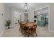 Cozy dining area with chandelier, seamlessly connected to the kitchen and living spaces at 179 Carrie Dr, Archer Lodge, NC 27527