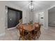Dining room with modern chandelier and decorative wall at 179 Carrie Dr, Archer Lodge, NC 27527