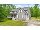 Charming two-story home with gray siding, white trim, front porch, and well-maintained landscaping at 179 Carrie Dr, Archer Lodge, NC 27527