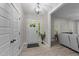 Bright foyer with wood-look floors, coat closet, and entry to the living area at 179 Carrie Dr, Archer Lodge, NC 27527