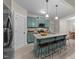 Stylish kitchen with island seating, granite countertops, and stainless steel appliances at 179 Carrie Dr, Archer Lodge, NC 27527