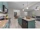 Well-equipped kitchen with granite countertops, stainless steel appliances, and access to dining and living area at 179 Carrie Dr, Archer Lodge, NC 27527