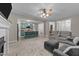 Open living space connected to kitchen with island and bar stools, showcasing a modern design at 179 Carrie Dr, Archer Lodge, NC 27527