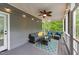 Cozy screened porch with comfortable seating, ceiling fan, and a view of the outdoors at 179 Carrie Dr, Archer Lodge, NC 27527
