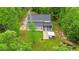 Aerial view of the home's rear exterior featuring lush landscaping and outdoor amenities at 179 Carrie Dr, Archer Lodge, NC 27527