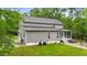 The gray siding complements the screened in porch and the hot tub on the back side of the house at 179 Carrie Dr, Archer Lodge, NC 27527