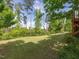 Private, fenced backyard with a lush green lawn, perfect for relaxation and outdoor activities at 1824 Amberly Ledge Way, Cary, NC 27519