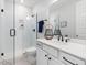 Modern bathroom with tiled shower, white vanity, and contemporary fixtures at 1824 Amberly Ledge Way, Cary, NC 27519