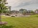 A well-kept community park and green space with walking paths, landscaping, and neighborhood views at 1824 Amberly Ledge Way, Cary, NC 27519
