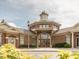 Beautiful brick building exterior with arched entryway and a tower in this stunning community building at 1824 Amberly Ledge Way, Cary, NC 27519