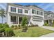 Charming two-story home featuring a landscaped yard and a covered porch at 1824 Amberly Ledge Way, Cary, NC 27519