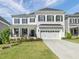 Charming two-story home featuring a landscaped yard, covered porch, and a two car garage at 1824 Amberly Ledge Way, Cary, NC 27519
