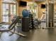 Bright and spacious gym equipped with weights, machines, and a full range of equipment to maintain fitness at 1824 Amberly Ledge Way, Cary, NC 27519