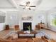 Bright and inviting living room with a fireplace and an open-concept layout at 1824 Amberly Ledge Way, Cary, NC 27519