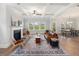 Bright and inviting living room with a fireplace and an open-concept layout to the dining area at 1824 Amberly Ledge Way, Cary, NC 27519