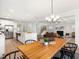 Bright, open living space with wood floors, modern lighting, and stainless steel appliances at 1824 Amberly Ledge Way, Cary, NC 27519