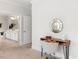 Office nook featuring a wooden desk and a view into the ensuite bathroom at 1824 Amberly Ledge Way, Cary, NC 27519