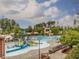 Large community pool featuring a splash pad, slides, and a lifeguard stand for all-day summer fun at 1824 Amberly Ledge Way, Cary, NC 27519
